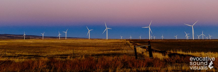 Multiple 123.10 meter tall S88 wind turbines, manufactured by Suzlon Energy and installed in 2009, are seen at twilight in Glenns Ferry, Idaho on October 12, 2018. Part of the Mountain Home Wind Project, each turbine, with a rotor diameter of 88 metes, can produce 2.5 MW of electricity. Photo by Richard Alan Hannon