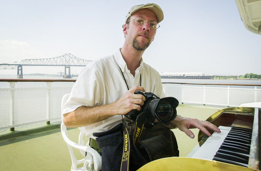 Richard Alan Hannon tries his hand at the Delta Queen riverboat's calliope while docked in Baton Rouge, Louisiana on Auguest 28, 2002.