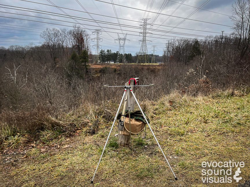 Capturing the sound of the electromagnetic field eminating from multiple 345kV overhead power transmission lines in Walton Hills, Ohio on Thursday, January 11, 2024. On August 14, 2003, approximate 120 feet northwest of this location, these lines, sagging by strain put upon them by power-hungry air conditioners and other appliances, flashed over to overgrown trees, thus contributing to a cascading power failure that shut down the electrcity grid for much of the northeastern United States and southeastern Canana. Photo by Richard Alan Hannon