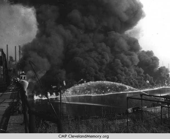 The Cuyahoga River burns near Jefferson St. and W. 3rd in Cleveland on November 1, 1952. Source: Cleveland State University/Michael Schwartz Library/Special Collections/Cleveland Memory Project. Photo by James Thomas.